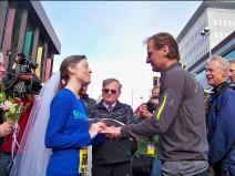 Ralph Fishburn, of Ralph's Regal Weddings, performing a wedding for a Kent, Washington couple at the start line of Bloomsday Race in Spokane Washington-first one ever!